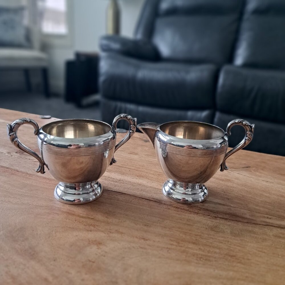 Set of silver plated milk/cream pitcher and sugar bowl,